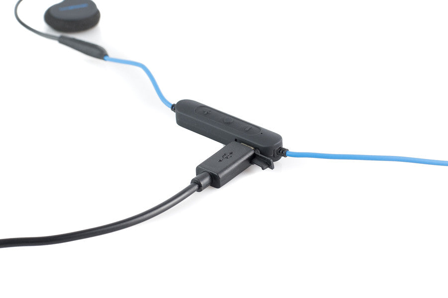 USB charging port on side of remote. USB to micro-USB charging cable included.