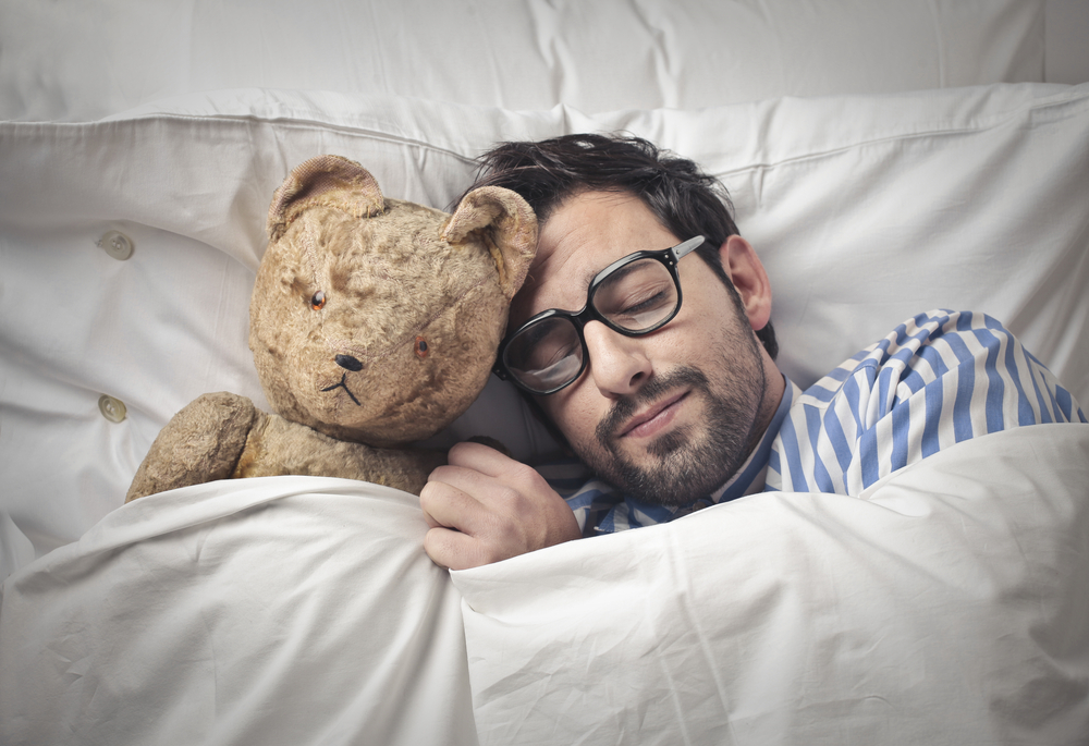 man-sleeping-soundly-with-teddy-bear.jpg